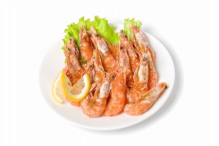 sea lettuce - tasty shrimp with lemon and lettuce isolated on a white Photographie de stock - Aubaine LD & Abonnement, Code: 400-04723500