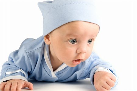 simsearch:400-04737497,k - Lying baby boy at on a white background Stockbilder - Microstock & Abonnement, Bildnummer: 400-04723517