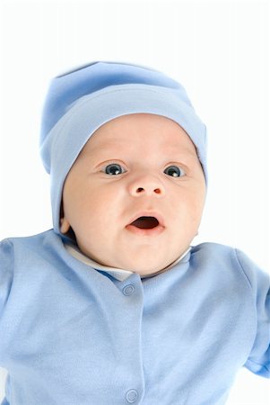 simsearch:400-04787509,k - Lying baby boy at blue on a white background Photographie de stock - Aubaine LD & Abonnement, Code: 400-04723519
