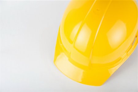 simsearch:400-04429200,k - Yellow helmet closeup on a white background Stock Photo - Budget Royalty-Free & Subscription, Code: 400-04723511