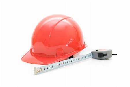 simsearch:400-04909076,k - Red Safety helmet and measuring tape isolated on white Photographie de stock - Aubaine LD & Abonnement, Code: 400-04723820