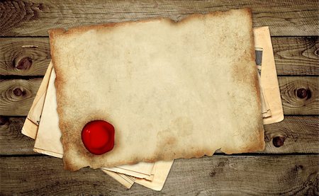 seal document - Old parchment with wax sea on wooden boards Stock Photo - Budget Royalty-Free & Subscription, Code: 400-04734197