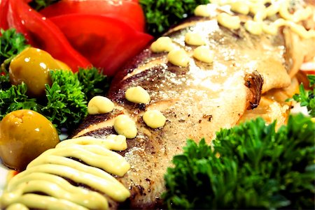 simsearch:400-04734276,k - Stuffed baked fish served with  salad Photographie de stock - Aubaine LD & Abonnement, Code: 400-04734246