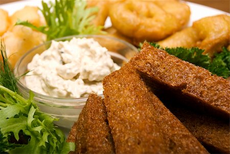 Appetizer made of fried onion, potato and bread Stockbilder - Microstock & Abonnement, Bildnummer: 400-04734261