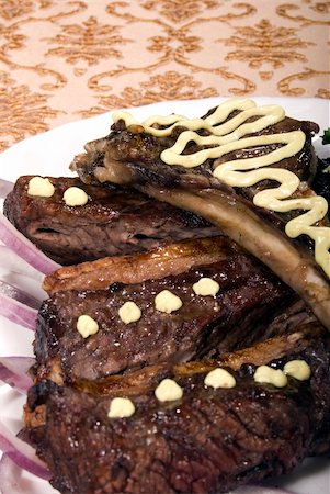 simsearch:400-05259212,k - Fried ribs served with the rings of onion Stock Photo - Budget Royalty-Free & Subscription, Code: 400-04734270
