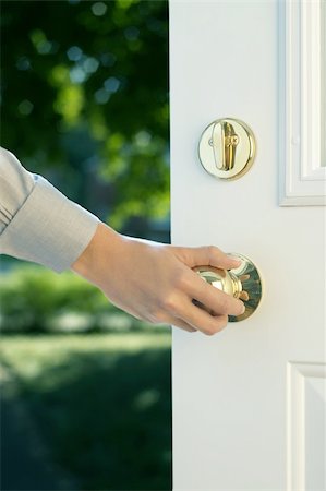 door handle with hand - a woman hand opening door to sunny bright view Stock Photo - Budget Royalty-Free & Subscription, Code: 400-04734629
