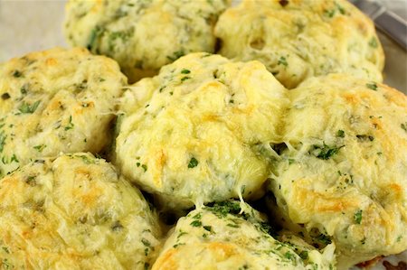 simsearch:400-05255035,k - Delicious fresh baked savory cheese and spinach scones ready to serve. Stock Photo - Budget Royalty-Free & Subscription, Code: 400-04734831