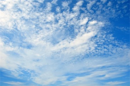 Fleecy clouds on dark blue sky Stock Photo - Budget Royalty-Free & Subscription, Code: 400-04735148