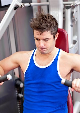 simsearch:400-04256139,k - Beautiful male athlete practicing body-building in a fitness center Stock Photo - Budget Royalty-Free & Subscription, Code: 400-04735419