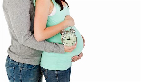 simsearch:400-04265188,k - close-up of  future parents holding a clock against a white background Stock Photo - Budget Royalty-Free & Subscription, Code: 400-04735507