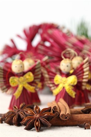 simsearch:400-04791848,k - Close-up of cloves, anise and cinnamon with straw Christmas angels. Shallow dof Stock Photo - Budget Royalty-Free & Subscription, Code: 400-04736086