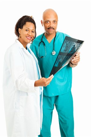 plaited hair for men - Attractive doctors holding a CT scan.  Isolated on white. Photographie de stock - Aubaine LD & Abonnement, Code: 400-04736123