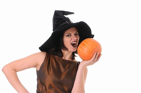 simsearch:400-08528806,k - Young witch with a pumpkin isolated on white background Photographie de stock - Aubaine LD & Abonnement, Code: 400-04736473