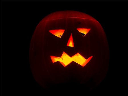 simsearch:400-04540383,k - Halloween pumpkin on black background lit by candles Stock Photo - Budget Royalty-Free & Subscription, Code: 400-04736509