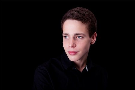 cute boy, smiling on black, studio shot Photographie de stock - Aubaine LD & Abonnement, Code: 400-04736573