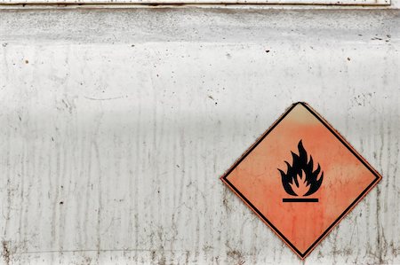 Flammable material weathered warning sign background. Fuel tank. Stock Photo - Budget Royalty-Free & Subscription, Code: 400-04737141