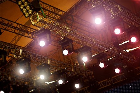 entertainment industry concepts - a stage light rack with spotlights shining down ,selective focus Stock Photo - Budget Royalty-Free & Subscription, Code: 400-04737438