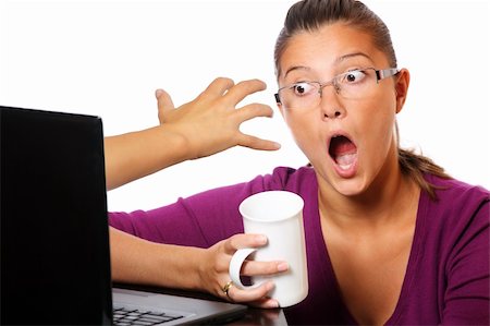 A picture of a hand coming out of computer and trying to catch a terrified young woman Stock Photo - Budget Royalty-Free & Subscription, Code: 400-04738099
