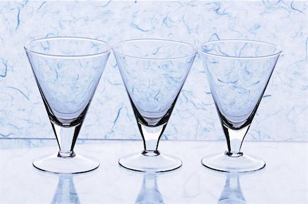 simsearch:400-07450722,k - Transparent empty glasses on blue background Stock Photo - Budget Royalty-Free & Subscription, Code: 400-04738343