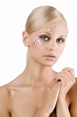 simsearch:400-05314365,k - blond young girl in a beauty portrait with creative make up and pink crystal stone on her face Foto de stock - Royalty-Free Super Valor e Assinatura, Número: 400-04738814
