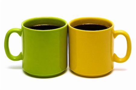 yellow and green mug on a white background Fotografie stock - Microstock e Abbonamento, Codice: 400-04730181