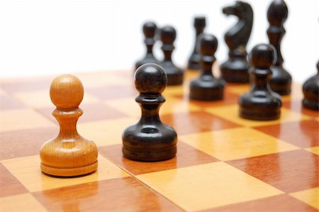 simsearch:400-04731516,k - One white pawn fights against black army on chess board. Fotografie stock - Microstock e Abbonamento, Codice: 400-04731518