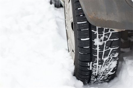 parked snow - Car wheel is stuck in the snow Stock Photo - Budget Royalty-Free & Subscription, Code: 400-04731541