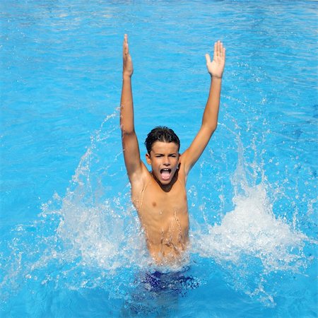 boy teenager splashing water open arms blue swimming pool Foto de stock - Super Valor sin royalties y Suscripción, Código: 400-04731599