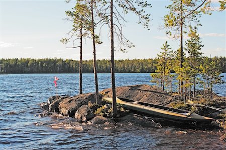 simsearch:400-04804407,k - Canoe on rocky island on northern lake Stock Photo - Budget Royalty-Free & Subscription, Code: 400-04732194