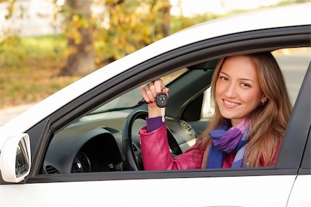 The happy woman showing the key of her new car. Stock Photo - Budget Royalty-Free & Subscription, Code: 400-04732390