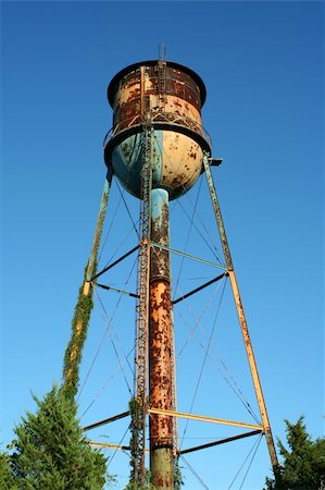 rusting tank - A Old rusty watertower against blue sky Stock Photo - Budget Royalty-Free & Subscription, Code: 400-04732403