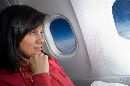 young caucasian woman is sitting in the airplane and dreaming Foto de stock - Super Valor sin royalties y Suscripción, Código: 400-04733315