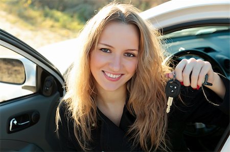 simsearch:400-06061542,k - Happy owner of a new car showing a key. Stock Photo - Budget Royalty-Free & Subscription, Code: 400-04733392
