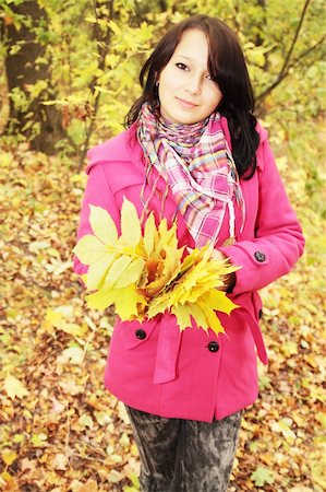 simsearch:400-07042487,k - Woman with the autumnal leafs in the pink coat Stock Photo - Budget Royalty-Free & Subscription, Code: 400-04733496