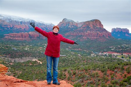 simsearch:400-08694885,k - An outdoor portrait of a beautiful woman with snow-covered Red Rocks in the background Photographie de stock - Aubaine LD & Abonnement, Code: 400-04744262