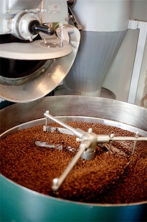 A machine which cools freshly roasted coffee beans.  Shallow depth of field, critical focus on back of beans Stock Photo - Budget Royalty-Free & Subscription, Code: 400-04745007