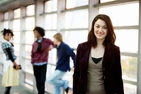A portrait of a young woman with friends in the background Stock Photo - Budget Royalty-Free & Subscription, Code: 400-04745033