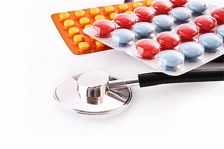 diet pills - Tablets and stethoscope isolated on white Stock Photo - Budget Royalty-Free & Subscription, Code: 400-04745288