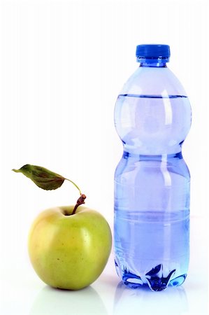 eating in the train - Bottle of sparkling water and green apple isolated on white Stock Photo - Budget Royalty-Free & Subscription, Code: 400-04745334