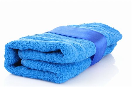 simsearch:400-04501066,k - Folded blue towel with the band isolated on white Stock Photo - Budget Royalty-Free & Subscription, Code: 400-04745369