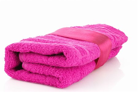 simsearch:400-04501066,k - Folded pink towel with the band isolated on white Stock Photo - Budget Royalty-Free & Subscription, Code: 400-04745370