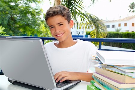Happy teenager student boy working laptop computer in garden outdoor Photographie de stock - Aubaine LD & Abonnement, Code: 400-04746663