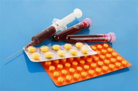 simsearch:400-07897806,k - Medical test tubes with blood and medicines on blue Stock Photo - Budget Royalty-Free & Subscription, Code: 400-04746690