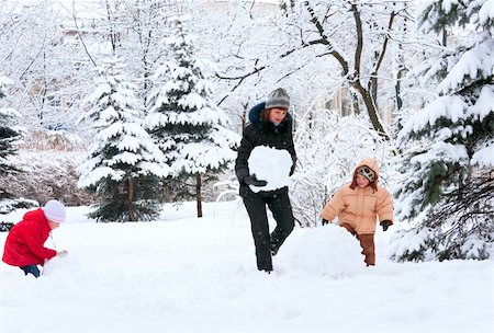 family with snowman - Happy family (mother with small boy and girl) in winter city park Stock Photo - Budget Royalty-Free & Subscription, Code: 400-04747697