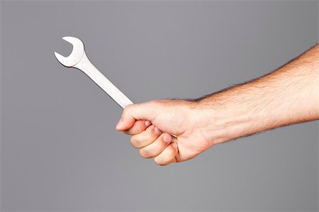 simsearch:400-05058869,k - An image of a man holding a wrench Foto de stock - Royalty-Free Super Valor e Assinatura, Número: 400-04749637