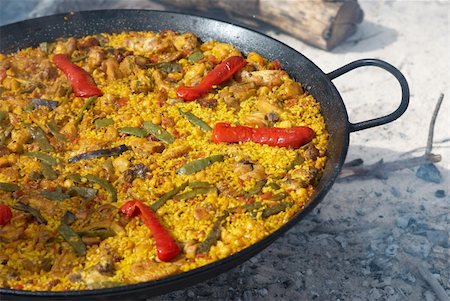 pan to the fire - Traditional outdoor cooking of paella on open fire Stock Photo - Budget Royalty-Free & Subscription, Code: 400-04740009