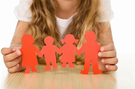 parent holding hands child silhouette - Kids concept of family with little girl holding paper people - closeup Stock Photo - Budget Royalty-Free & Subscription, Code: 400-04740137
