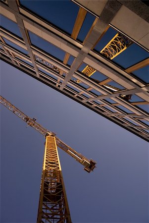 simsearch:400-05074551,k - Low angle view of a crane reflected in the windows of an office building Photographie de stock - Aubaine LD & Abonnement, Code: 400-04740649