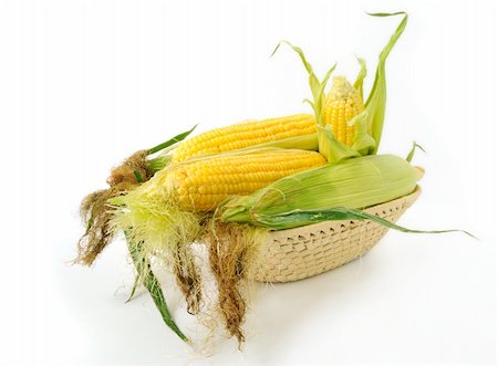 simsearch:400-05693764,k - Fresh corncobs in a basket on white background Stock Photo - Budget Royalty-Free & Subscription, Code: 400-04740790