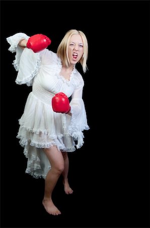simsearch:400-04423524,k - A beautiful young woman wearing a pair of boxing gloves Stock Photo - Budget Royalty-Free & Subscription, Code: 400-04741188